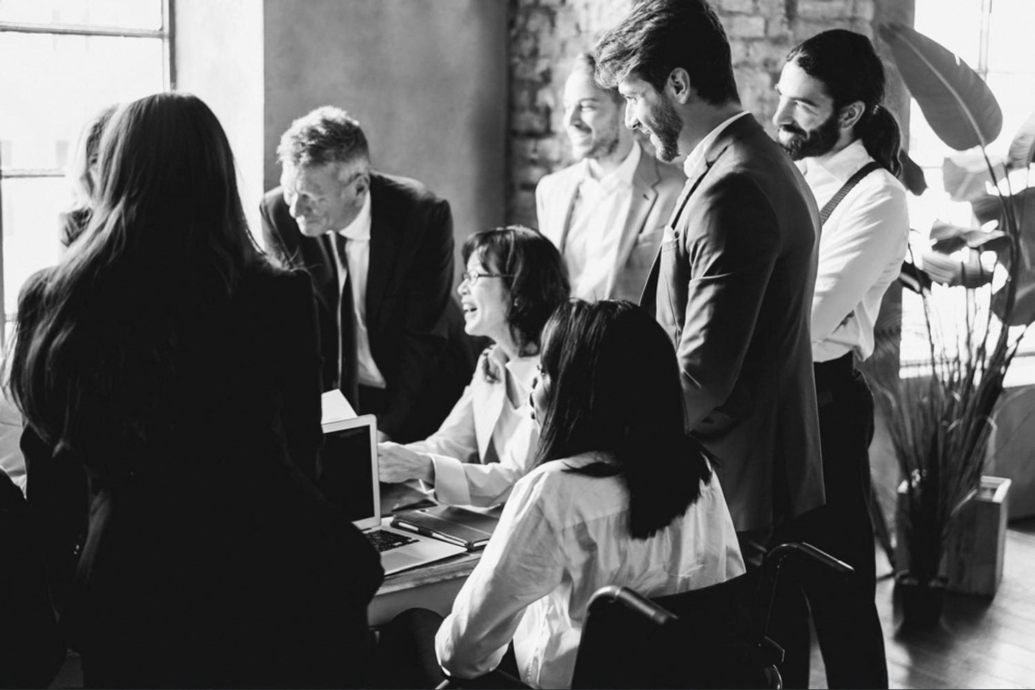 HR professionals discussing employee engagement analysis results in a modern office